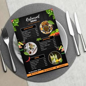 May include: A restaurant menu with a black background, featuring sections for main dishes, appetizers, and drinks. The menu includes prices and images of food and drinks. The menu is on a white plate with silverware and a gray placemat.