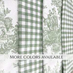 May include: Close-up of fabric samples in green and white. The fabrics include a gingham pattern and a pastoral toile design. The text "MORE COLORS AVAILABLE" is displayed across the bottom of the image.