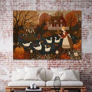 May include: A wall art print depicting a person in a brown dress and white apron standing by a pond with four white ducks. The scene includes a red house, orange autumn trees, and several orange pumpkins in the foreground, all rendered in a detailed, illustrative style with warm fall colors.