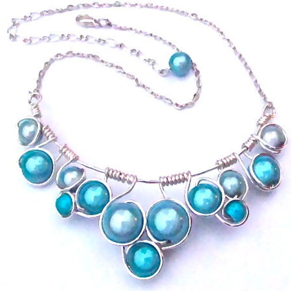 Glowing Turquoise "Miracle Beads" Silver craft wire and adjustable chain.