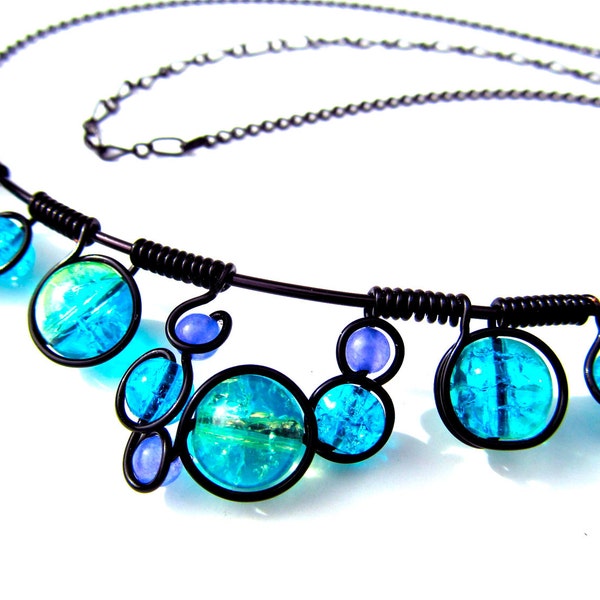 Wire wrapped necklace with blue and purpe crackle glass beads, black wire and adjustable chain