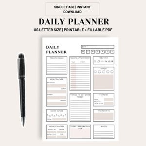 May include: A black pen rests beside a white daily planner. The planner includes sections for goals, appointments, meal tracking, water intake, and a money tracker. Text on the planner reads "Daily Planner" and "US Letter Size | Printable + Fillable PDF."