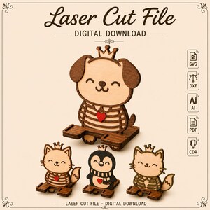May include: A laser cut file digital download featuring four wooden animal phone stands: a dog, two cats, and a penguin. Each animal wears a crown and has a red heart accent. The text Laser Cut File and Digital Download is visible.