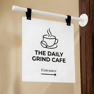May include: A white rectangular sign for "THE DAILY GRIND CAFE" with a coffee cup and bean graphic. The sign is suspended from a white rod with black leather straps. The word "Entrance" and an arrow are below the cafe name.