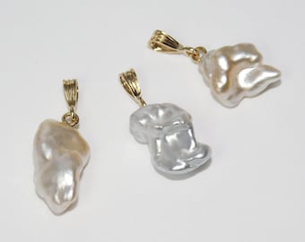 May include: Three baroque pearl pendants with gold-tone clasps. The pearls are irregular in shape and have a white, cream, and grey colour.