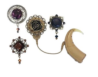 Colección de accesorios para implantes cocleares con cristales y piedras de colores brillantes