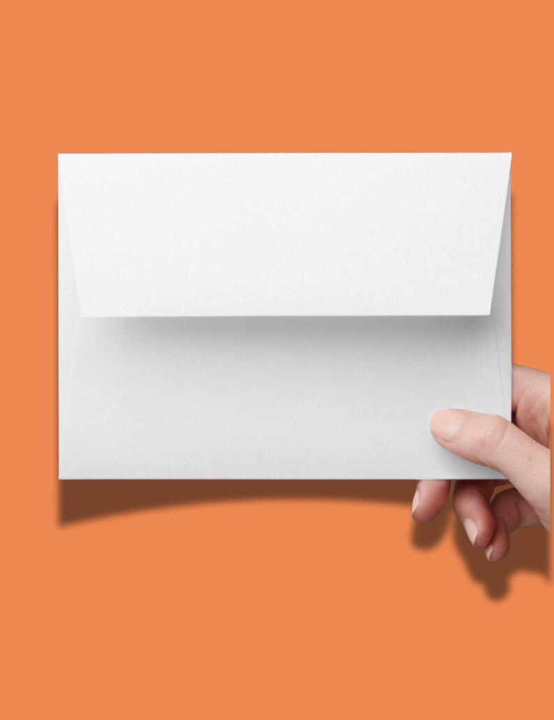 May include: A rectangular white paper envelope with a pointed flap folded down. The envelope is blank and features a smooth, matte texture. It is held horizontally, showcasing a clean, minimalist design suitable for stationery or mailing purposes.