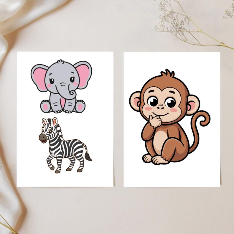 May include: Two white cards with cartoon animal illustrations. One card features a gray elephant with pink ears, and a zebra with black and white stripes. The other card has a brown monkey with a thoughtful expression.