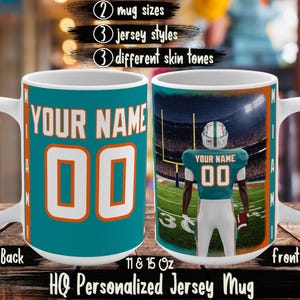 May include: A white ceramic mug with a teal and orange football jersey design. The front of the mug features a football player in a jersey with the name and number "00". The back of the mug has the same jersey design with the text "YOUR NAME" and the number "00".