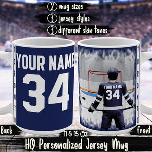 May include: White ceramic mug with a navy blue jersey design. The mug features the text "YOUR NAME" and the number "34" in white. The front of the mug shows a hockey player. The mug is labeled "HQ Personalized Jersey Mug".