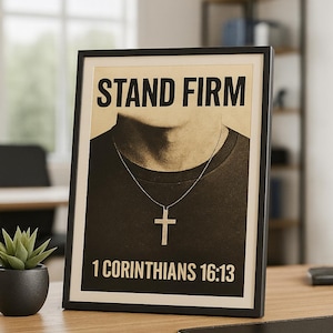 May include: Framed poster with the words "STAND FIRM" in bold letters. Below the text is a person wearing a necklace with a cross pendant. The text "1 CORINTHIANS 16:13" is at the bottom.