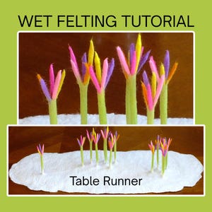 Könnte beinhalten: Ein weißer Filz-Tischläufer mit mehreren aufrechten grünen Stielen, die mit leuchtend rosa, gelben, violetten und orangefarbenen Filzblütenblättern versehen sind. Der Text WET FELTING TUTORIAL und Table Runner ist auf dem Bild zu sehen.