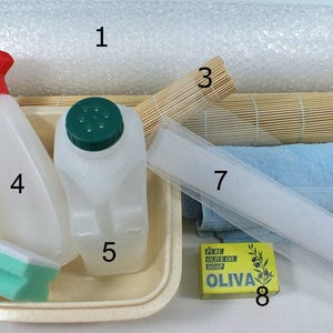 The photo shows the basic equipment you need to make wet felt.  Bubble wrap, rolling mat, netting, towel, soap, water sprinkler bottle, bowl, sponge