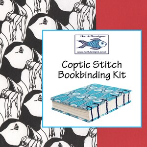 May include: A Coptic stitch bookbinding kit featuring a book with a turquoise and white patterned cover and exposed dark blue stitching. The text reads Nant Designs, www.nantdesigns.co.uk, and Coptic Stitch Bookbinding Kit. The background shows a black and white puffin pattern.