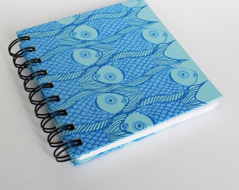 Handmade , small, artists notebook or sketchbook in blue fish design, blank, hardback, Ring bound blank pocket size.