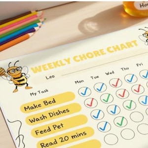 May include: A weekly chore chart with the text "Weekly Chore Chart" and "Leo" printed on it. The chart includes tasks like "Make Bed", "Wash Dishes", "Feed Pet", and "Read 20 mins". Colourful pencils and a jar of honey are in the background.
