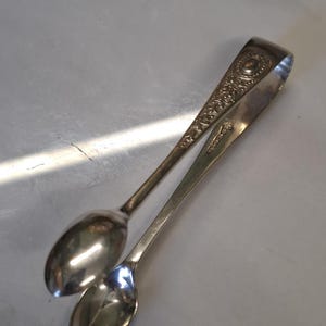 antique silver plate ornate oval decoration sugar tongs