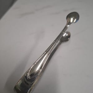 antique silver plate sugar tongs
