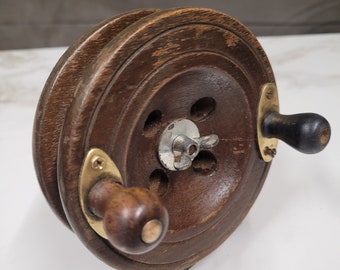 antique wood and brass fishing reel