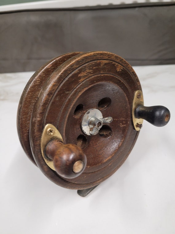 antique wood and brass fishing reel