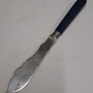 antique etched silver plate blue plastic handle butter knife