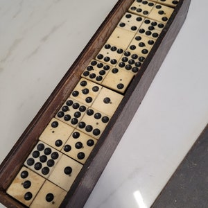 antique set of boxed 9,s dominoes