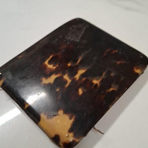 antieke opvouwbare harde bruine portemonnee