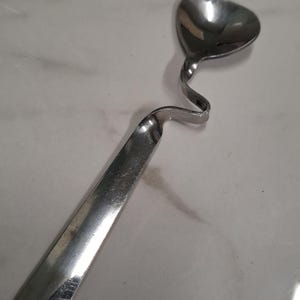 vintage stalen wiebeljamlepel