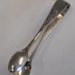antique silver plate ornate sugar tongs