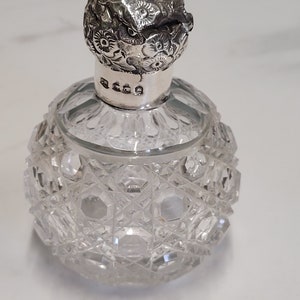 antique London silver floral lid round glass perfume bottle