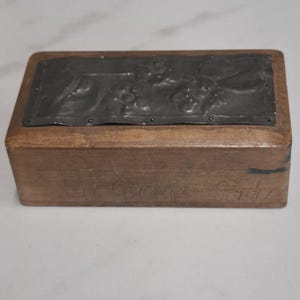 antique metal decorated stamp storage box