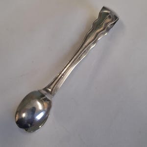 antique silver plate wobbly edge sugar tongs
