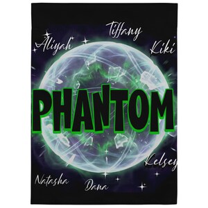 May include: Black blanket featuring a luminous green and white orb design. The word "Phantom" is in large, bold, green-outlined letters. Names such as "Tiffany" and "Kiki" are written in white script around the orb.