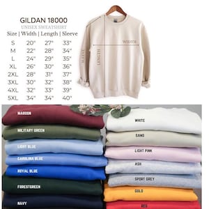Puede incluir: Una tabla de tallas y colores para una sudadera unisex Gildan 18000. La tabla muestra las medidas para las tallas S-5XL, incluyendo ancho, largo y largo de manga en pulgadas. Se muestran varios colores, como granate y verde militar.