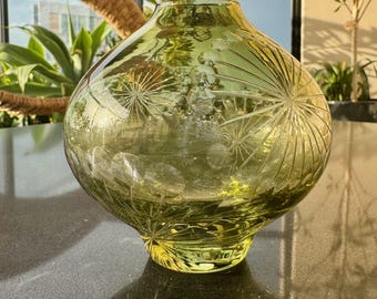 Small olive green glass bud vase with moulded starburst cut detailing