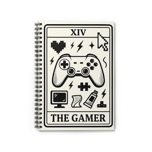 May include: Spiral-bound notebook with a cream cover featuring a black and white gamer design. The design includes a game controller, lightning bolts, and the text "THE GAMER". The top of the design has the Roman numeral XIV.