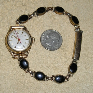 Signed Bulova Ladies Wrist Watch Wind Up With 1/20 12k Gold Filled Band Bezel Set Black Glass Stones. Classic! 1965 Vintage Jewelry 33010