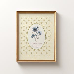 May include: A framed print featuring a watercolor illustration of blue flowers within an oval frame. The background is a light yellow with a repeating floral pattern. The text "The steadfast love of the Lord never ceases..." is below the flowers.