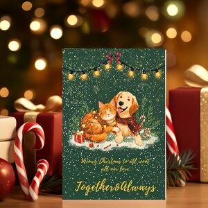 Könnte beinhalten: Eine Weihnachtskarte mit einem Golden Retriever und einer orangefarbenen Tabby-Katze, beide mit festlichen Schals. Die Karte trägt den Text "Meowy Christmas to all, woof, all our love. Together & Always."