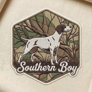 May include: A white ceramic mug with a black handle and the text "But First, Coffee" in a black, handwritten-style font. The mug is on a white surface.