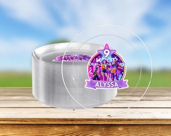 May include: A stack of clear plastic plates with a decorative overlay featuring a K-Pop theme. The overlay includes the number 9, the name "Alyssa", and a colorful graphic of K-Pop performers.
