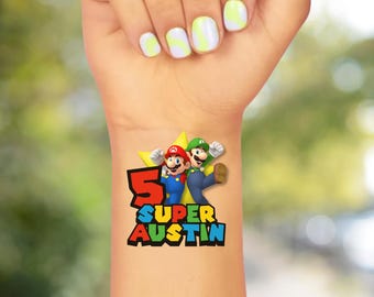May include: A colorful temporary tattoo featuring Mario and Luigi characters with the text "5 Super Austin". The design includes a red starburst and vibrant lettering, perfect for a birthday celebration or themed event.