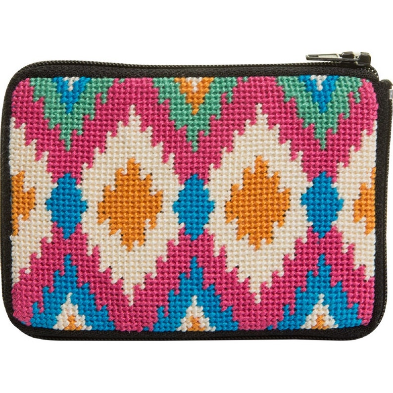 May include: A small, colorful zippered pouch with a geometric pattern in shades of pink, blue, green, white, and orange. The pouch is made of needlepoint fabric.