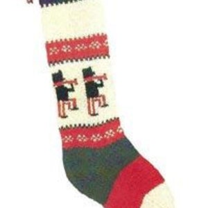 May include: Knit Christmas stocking with a red, white, and green color scheme. The stocking features a pattern of three black figures playing musical instruments.