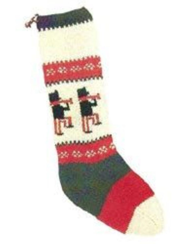May include: Knit Christmas stocking with a red, white, and green color scheme. The stocking features a pattern of three black figures playing musical instruments.