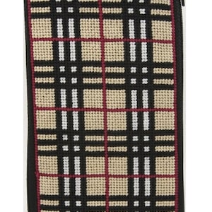 May include: A black, beige, white and red plaid zipped pouch. The pouch is made of needlepoint fabric.