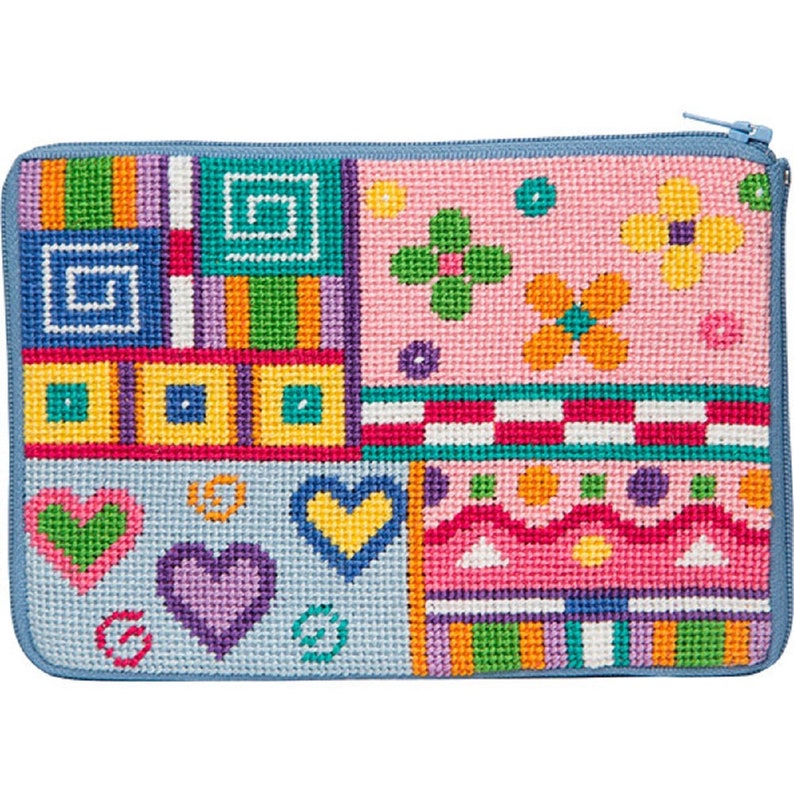 May include: A blue zippered pouch with a patchwork design featuring hearts, flowers, and geometric shapes in various colors, including pink, yellow, green, and purple.