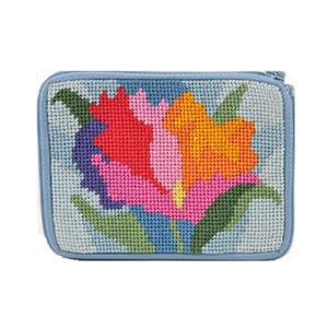 May include: A blue zippered pouch with a needlepoint design of a colorful flower.