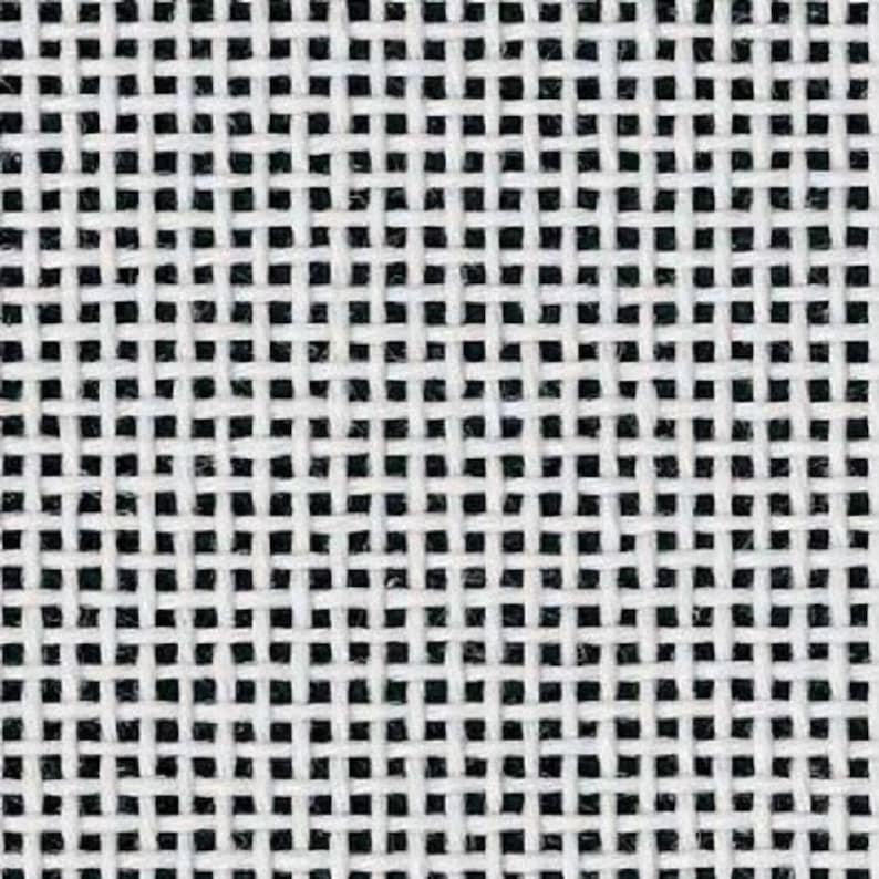 May include: White Aida cloth with a square grid pattern. The cloth is commonly used for cross-stitch projects.