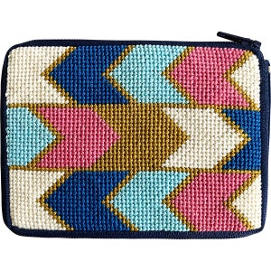 May include: A needlepoint zippered pouch with a geometric pattern of white, blue, pink, and gold arrows.